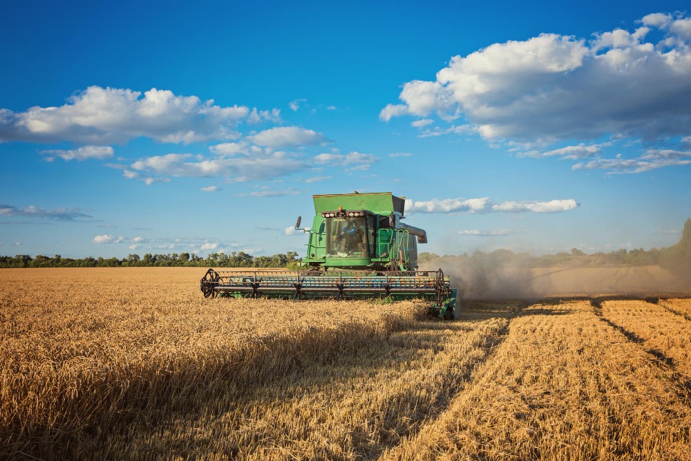 Image by Oleksandr Ryzhkov on Freepik Harvesting combine in the field